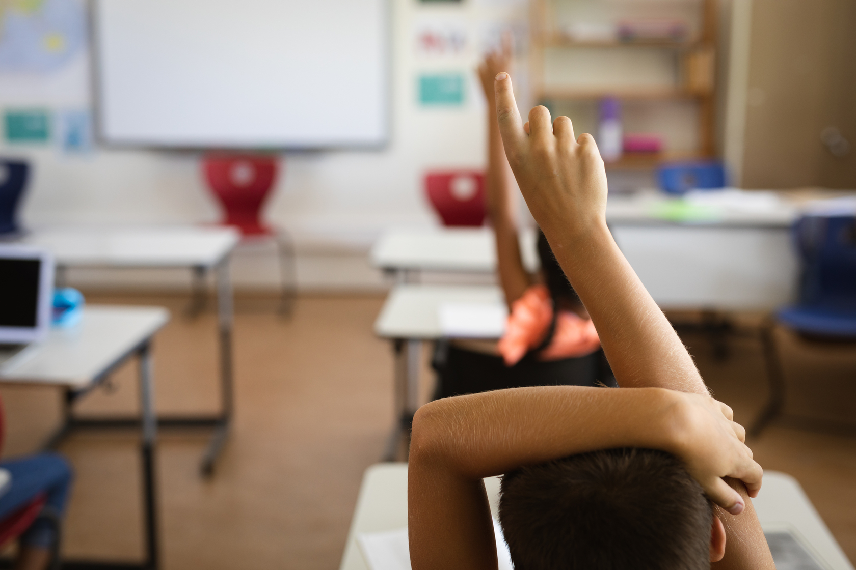rear-view-of-boy-raising-his-hand-for-participatio-2021-09-04-11-47-27-utc (1)